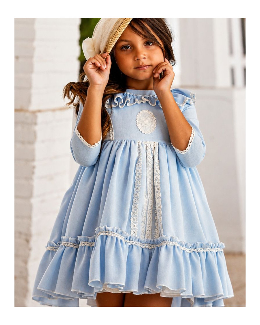 Vestido ceremonia celeste con acabados en crudo