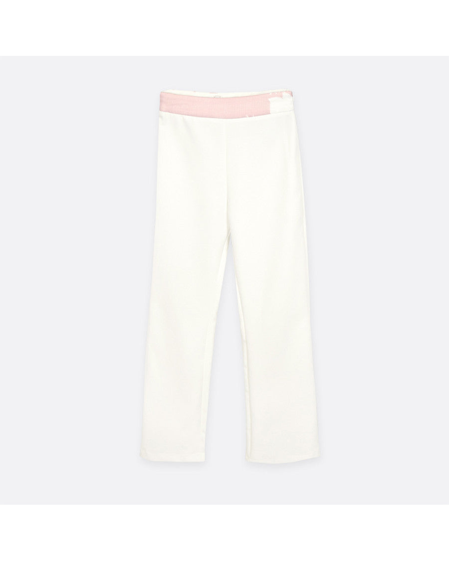 Conjunto top estampado rosa y pantalón.